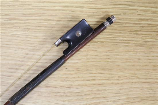 A silver mounted violin bow, an ivory mounted violin bow and a late 19th century German violin, cased